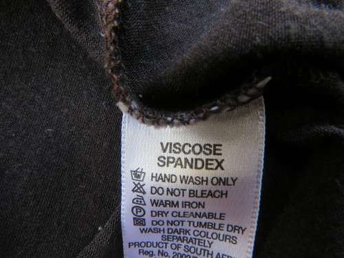 Choc brown stretch viscose slip over top.See through long sleeves.V neck.Diamond shape decor.Size 38