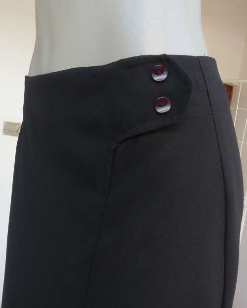 Elegant ankle length black pencil skirt. Slit at left side and button decoration in waist.Size 36