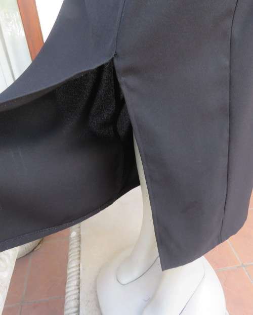 Elegant ankle length black pencil skirt. Slit at left side and button decoration in waist.Size 36