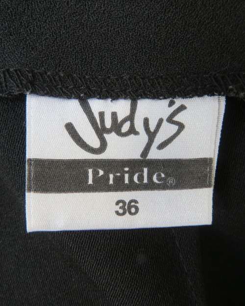 Elegant ankle length black pencil skirt. Slit at left side and button decoration in waist.Size 36