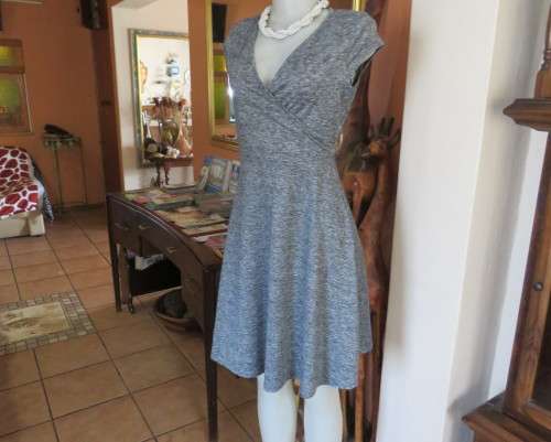 Sweet black/white mottled stretch polyester dress with capped sleeves.Fold over top.Size 34.As new