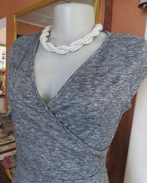 Sweet black/white mottled stretch polyester dress with capped sleeves.Fold over top.Size 34.As new