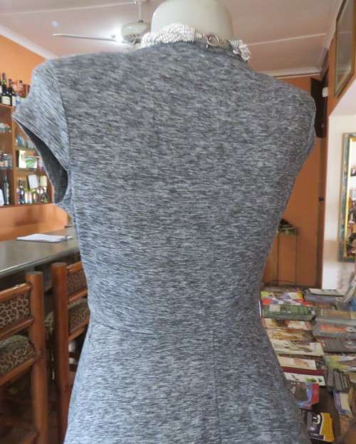 Sweet black/white mottled stretch polyester dress with capped sleeves.Fold over top.Size 34.As new