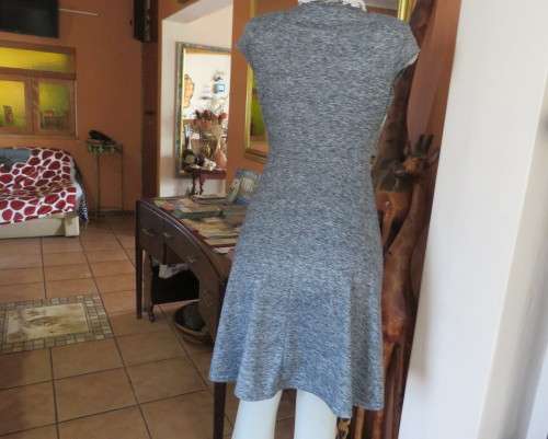 Sweet black/white mottled stretch polyester dress with capped sleeves.Fold over top.Size 34.As new