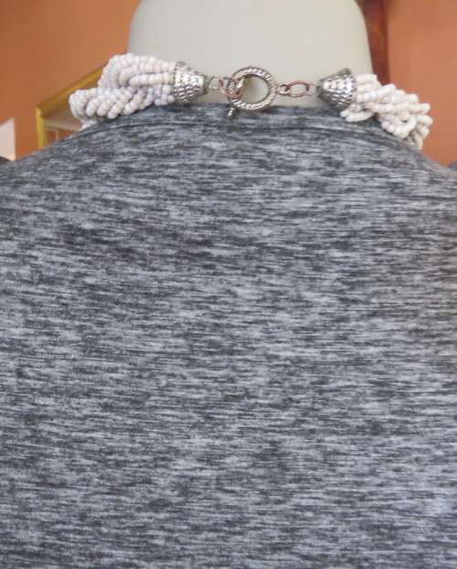 Sweet black/white mottled stretch polyester dress with capped sleeves.Fold over top.Size 34.As new