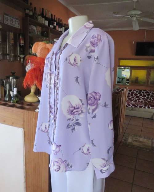 Lavender long sleeve blouse with button down front. Bold purple/white flowers.Size 42 by AREZZO.