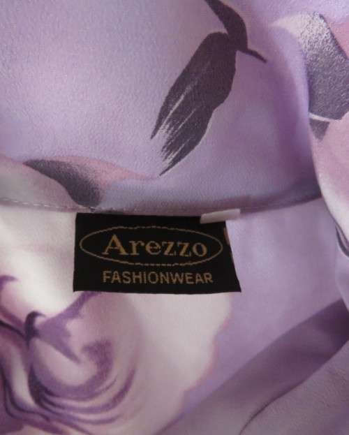 Lavender long sleeve blouse with button down front. Bold purple/white flowers.Size 42 by AREZZO.