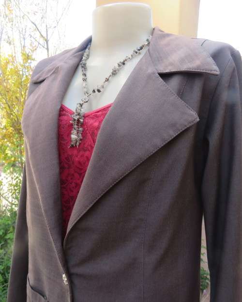 Light weight 2 pc smoke grey skirt suite.Long sleeve 1 button jacket/bandless skirt size 38.As new.