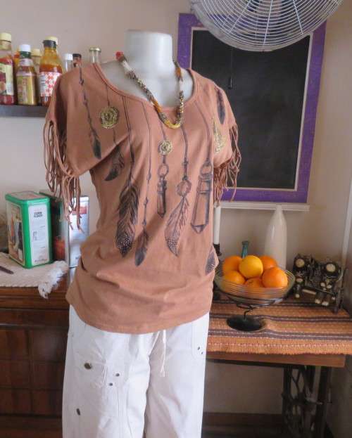 Unique golden brown LEGIT size 34/10 slip over top.Fringed armholes.Front feather/gold patterned.