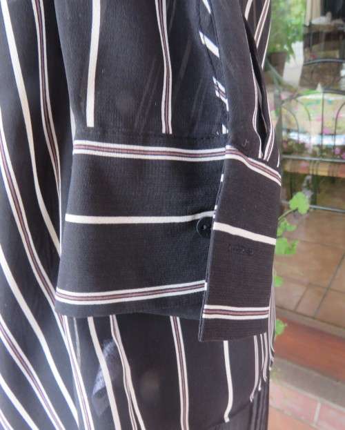 Smart,versatile black/white striped long sleeve sheer polyester top by WOOLWORTHS size 40/16.As new.
