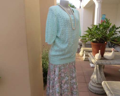 Beautiful handknitted mint green slip over top.Short raglan sleeves.Lace stitch front.Size 44 to 46.