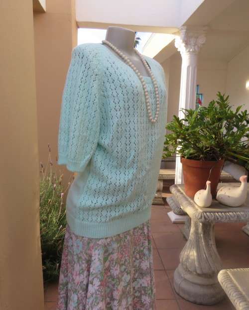 Beautiful handknitted mint green slip over top.Short raglan sleeves.Lace stitch front.Size 44 to 46.