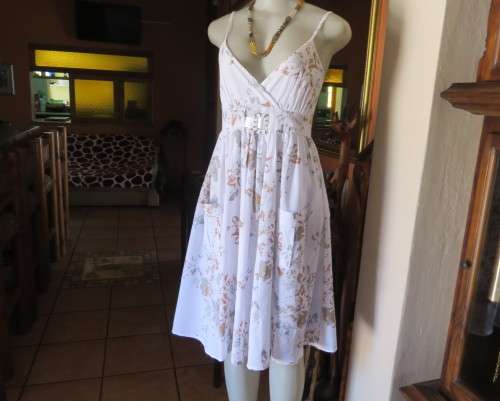 Awesome cool summer strappy dress in white /grey/brown flowers.Size 36/12.Fold over bust.As new