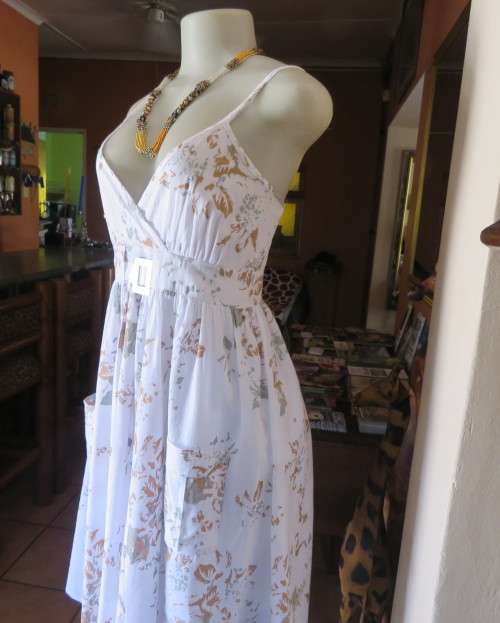 Awesome cool summer strappy dress in white /grey/brown flowers.Size 36/12.Fold over bust.As new