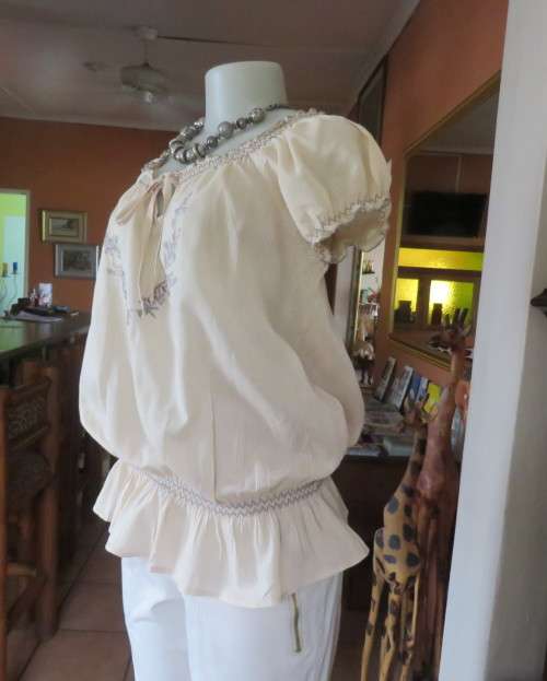 Peasant style rich cream embroidered slip over top by MILADY`S size 40/16.100% cotton.As new.