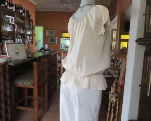 Peasant style rich cream embroidered slip over top by MILADY`S size 40/16.100% cotton.As new.