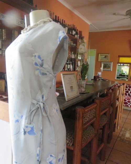 Cool light blue floral shift dress in poly/viscose.Slip over, sleeveless,round neckline. Size 37/13.