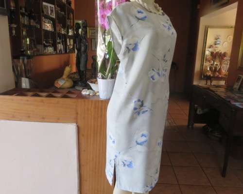 Cool light blue floral shift dress in poly/viscose.Slip over, sleeveless,round neckline. Size 37/13.