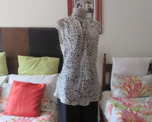 Fabulous slip over silky poly cream/black animal print  top.Size 36 by STUDIO W..Tie collar.