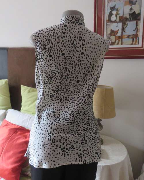 Fabulous slip over silky poly cream/black animal print  top.Size 36 by STUDIO W..Tie collar.