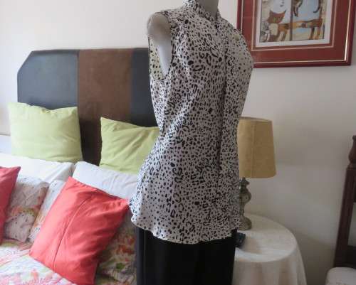Fabulous slip over silky poly cream/black animal print  top.Size 36 by STUDIO W..Tie collar.