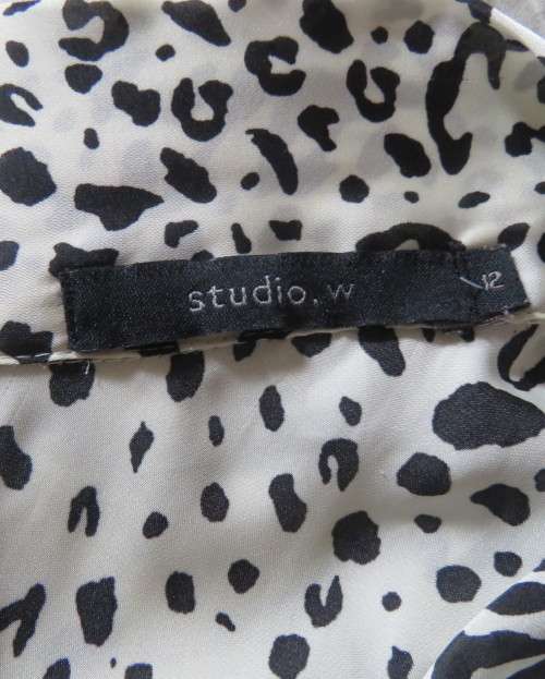 Fabulous slip over silky poly cream/black animal print  top.Size 36 by STUDIO W..Tie collar.