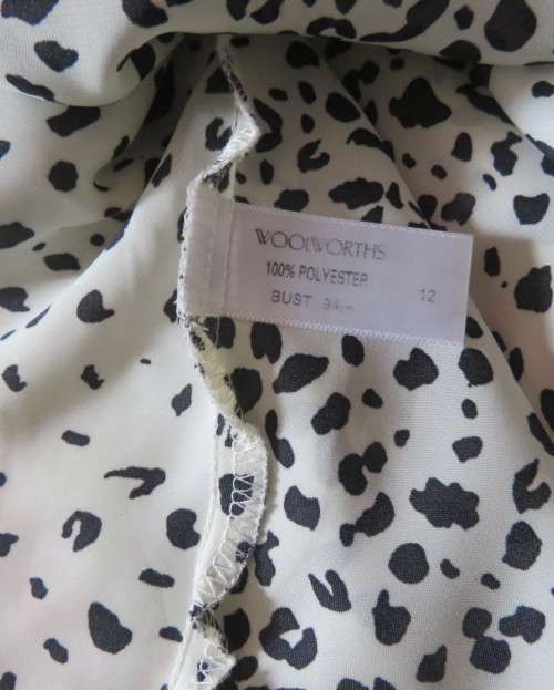 Fabulous slip over silky poly cream/black animal print  top.Size 36 by STUDIO W..Tie collar.