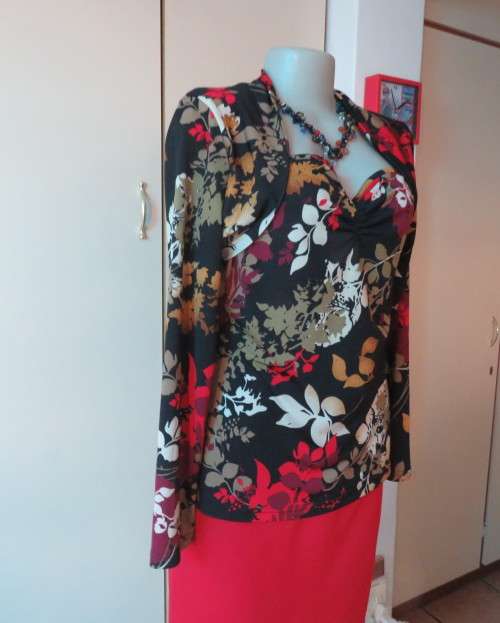Black stretch polyester background with red,purple and gold floral pattern top.Tiny bolero.Size 38