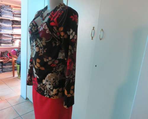 Black stretch polyester background with red,purple and gold floral pattern top.Tiny bolero.Size 38
