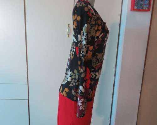 Black stretch polyester background with red,purple and gold floral pattern top.Tiny bolero.Size 38