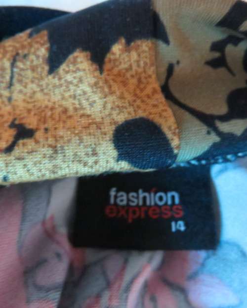 Black stretch polyester background with red,purple and gold floral pattern top.Tiny bolero.Size 38