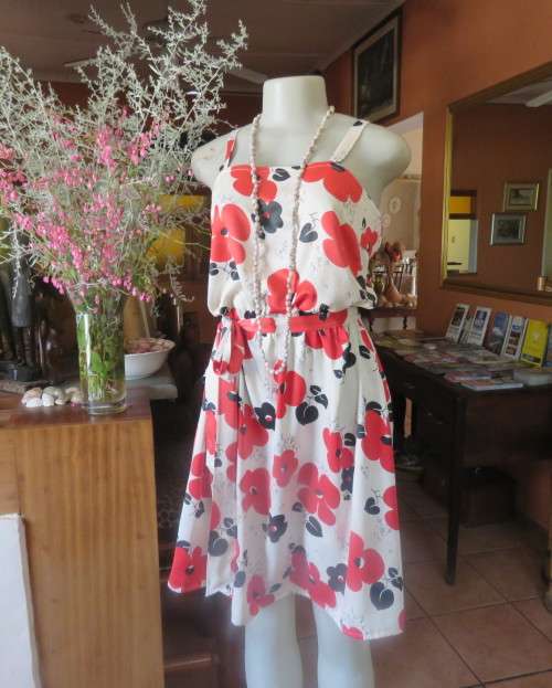 Cool cream strappy dress with red/black bold flowers.In soft polyester.Size 38.As new cond.