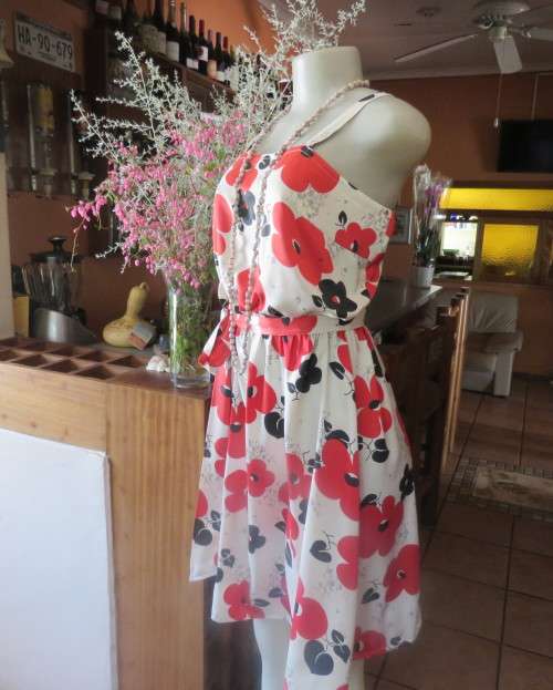 Cool cream strappy dress with red/black bold flowers.In soft polyester.Size 38.As new cond.