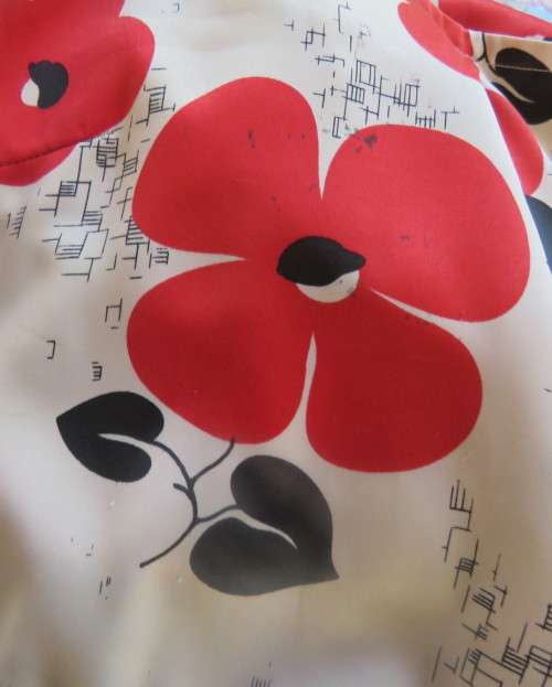 Cool cream strappy dress with red/black bold flowers.In soft polyester.Size 38.As new cond.