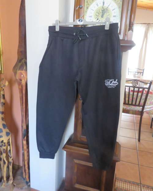 Men`s as new brushed polyester sweatpants. Knitted waist/drawstring and leg cuffs.Size XXL by RED