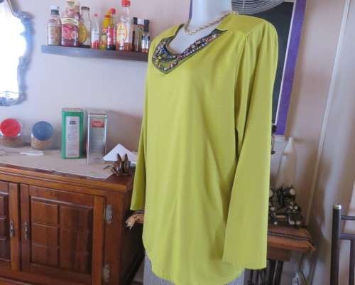 Stunning slip over avo green long sleeve polyester/viscose top size 44/20.Front embellishment.As new
