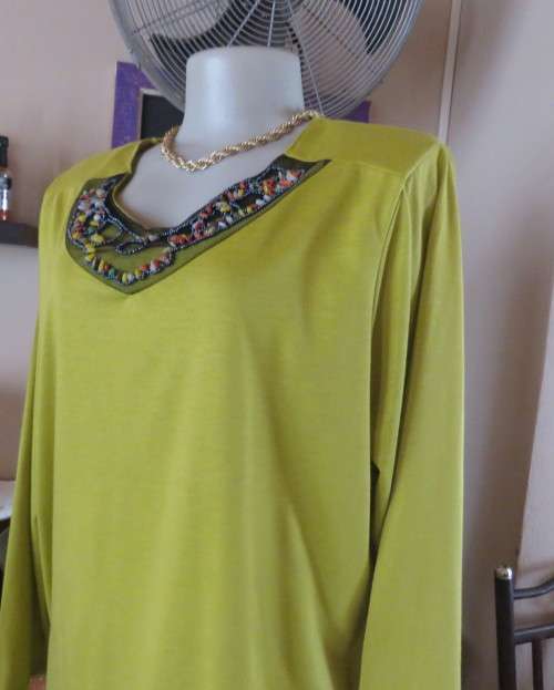 Stunning slip over avo green long sleeve polyester/viscose top size 44/20.Front embellishment.As new