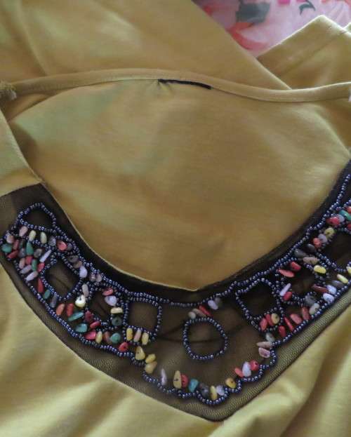 Stunning slip over avo green long sleeve polyester/viscose top size 44/20.Front embellishment.As new