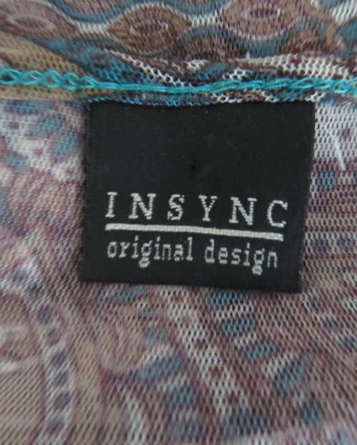 Pretty sheer polyester long sleeve top in jade/cream bo-ho print with scooped neckline.Size 32/8.