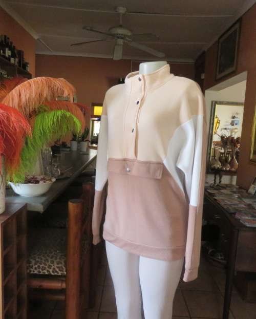 Cosy, warm cream/tan/white colour block long sleeve brushed polyester top.Size 38/14.Dolman sleeves.