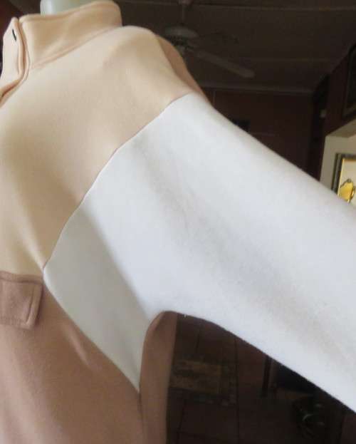Cosy, warm cream/tan/white colour block long sleeve brushed polyester top.Size 38/14.Dolman sleeves.