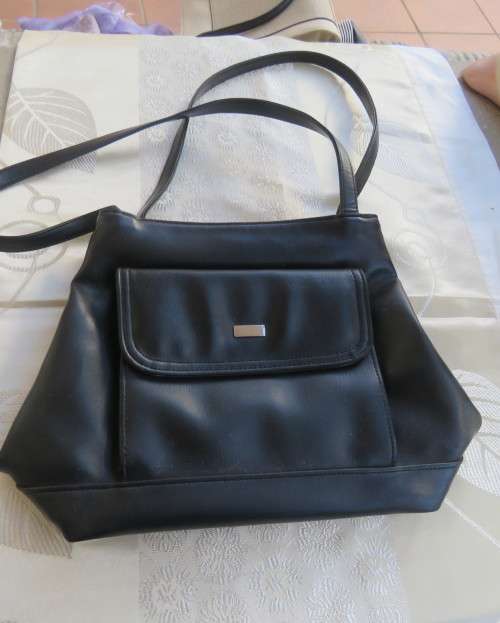 Fabulous soft black faux leather shoulder bag.3 divisions.Zip-ups + press button.26cm x 32cm.As new