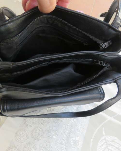 Fabulous soft black faux leather shoulder bag.3 divisions.Zip-ups + press button.26cm x 32cm.As new