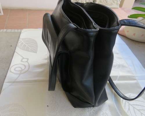 Fabulous soft black faux leather shoulder bag.3 divisions.Zip-ups + press button.26cm x 32cm.As new
