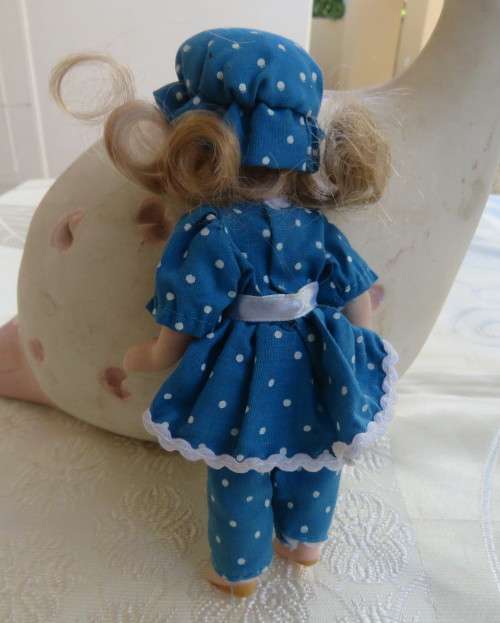 Antique doll 16cm tall with clothing. See all scans. In very good condition