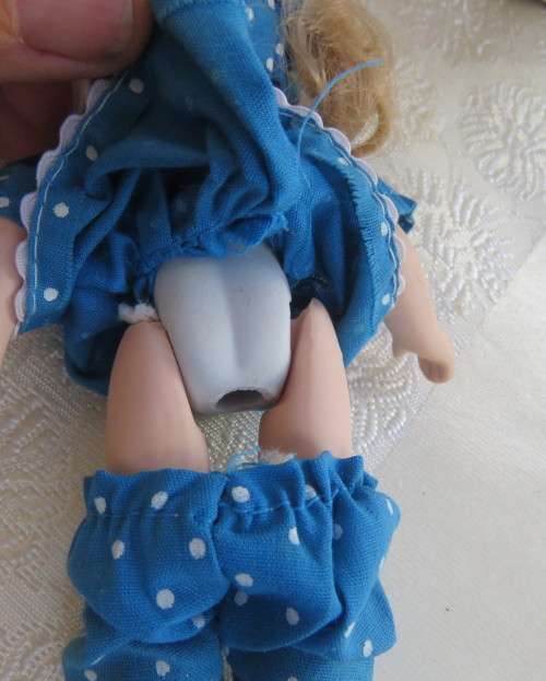 Antique doll 16cm tall with clothing. See all scans. In very good condition