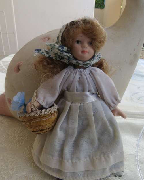 Antique doll 16cm tall with clothing. See scans. Very good condition