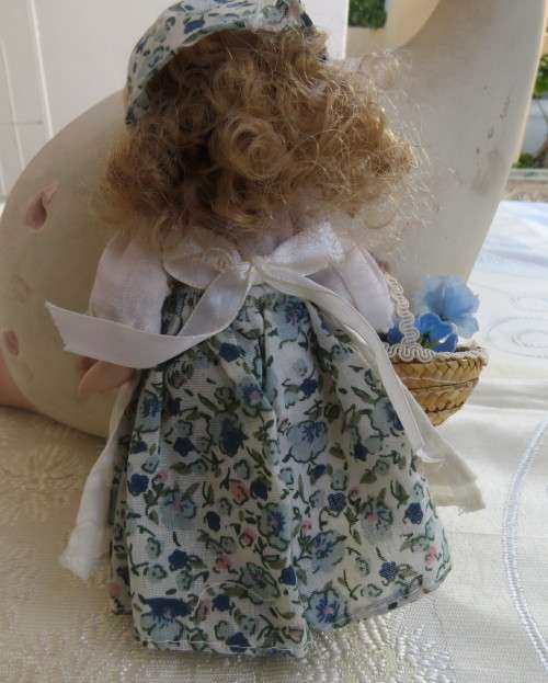 Antique doll 16cm tall with clothing. See scans. Very good condition