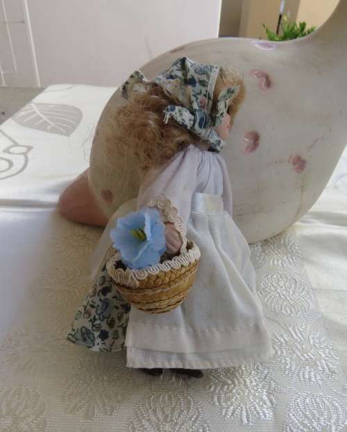 Antique doll 16cm tall with clothing. See scans. Very good condition