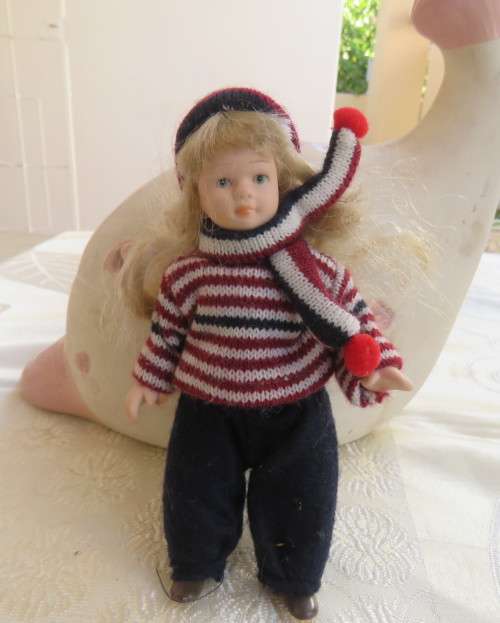 Antique doll 16cm tall with clothing. See scans. Very good condition